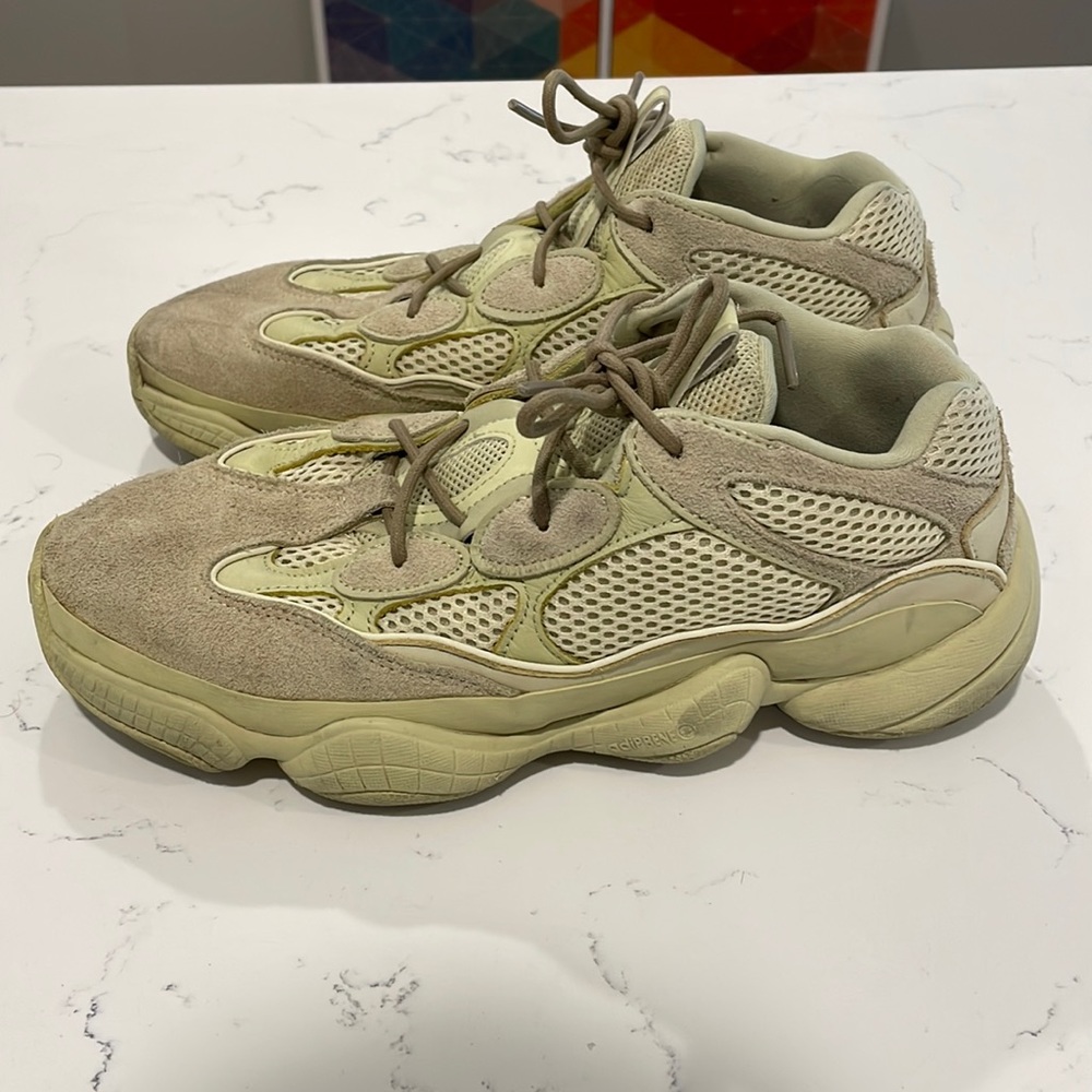 Yeezy size 9 shoe.  Wear and tear make them look vintage! Green/tan color.